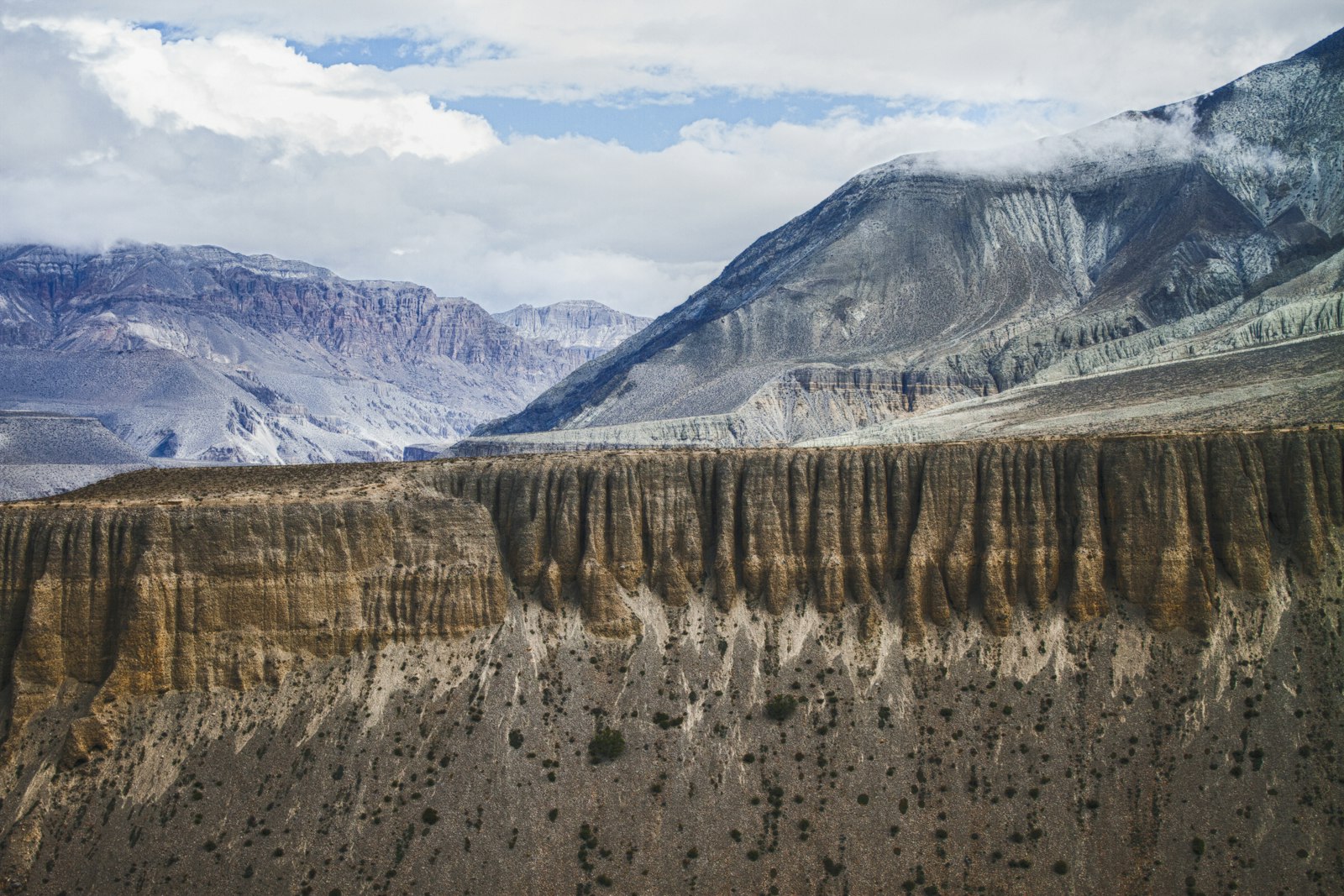 Ochre wind-carved cliffs of the Mustang badlands, Nepal