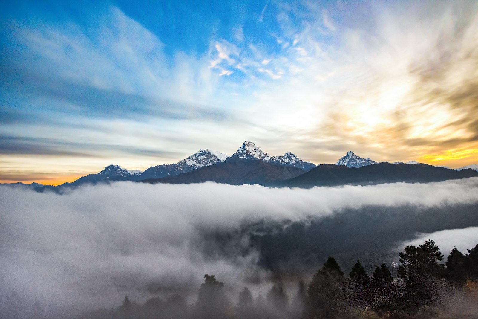 Sunrise over snow peaks and a cloud sea seen from Poon Hill in the Annapurna region, Nepal