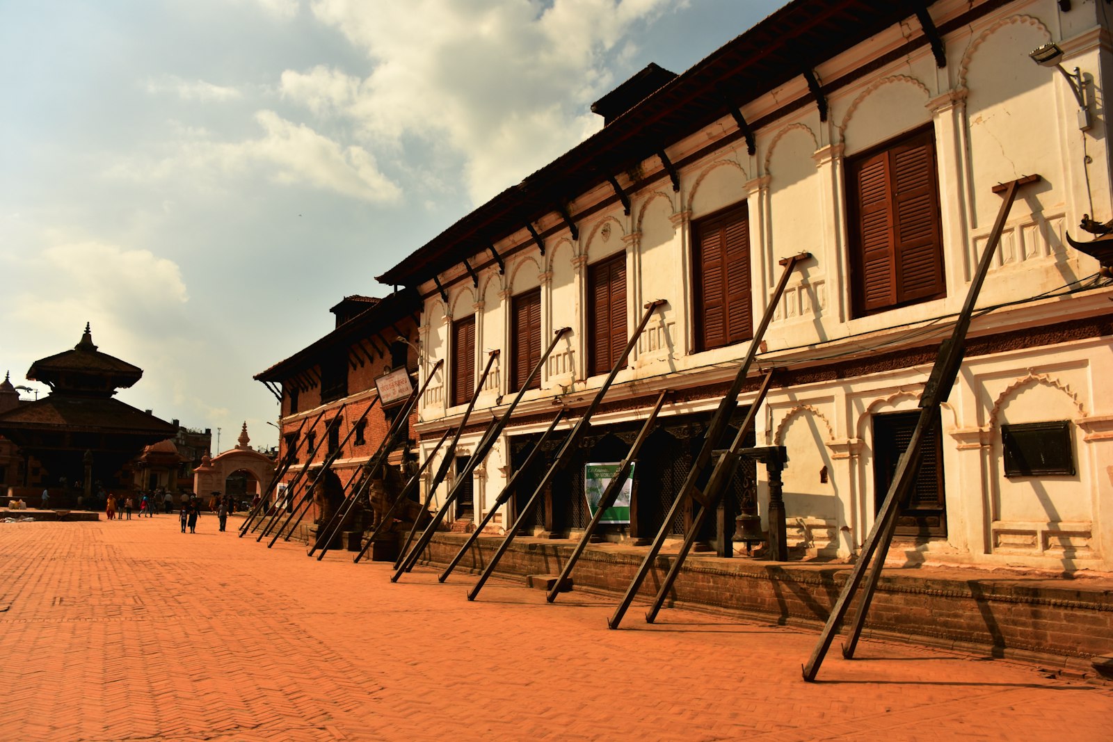 Brick temple with a steep stone stairway in a Bhaktapur heritage square